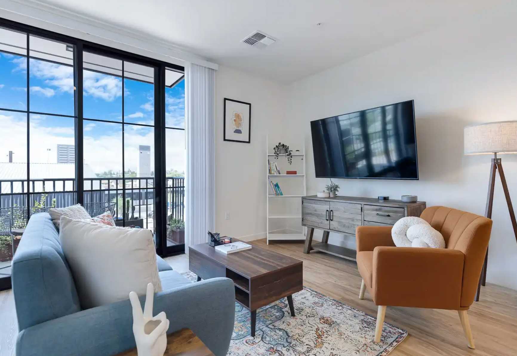 Living room with door to terrace that lets in lots of sunlight