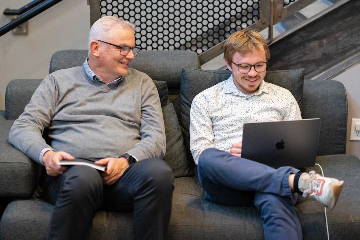 Working together on a couch in the office